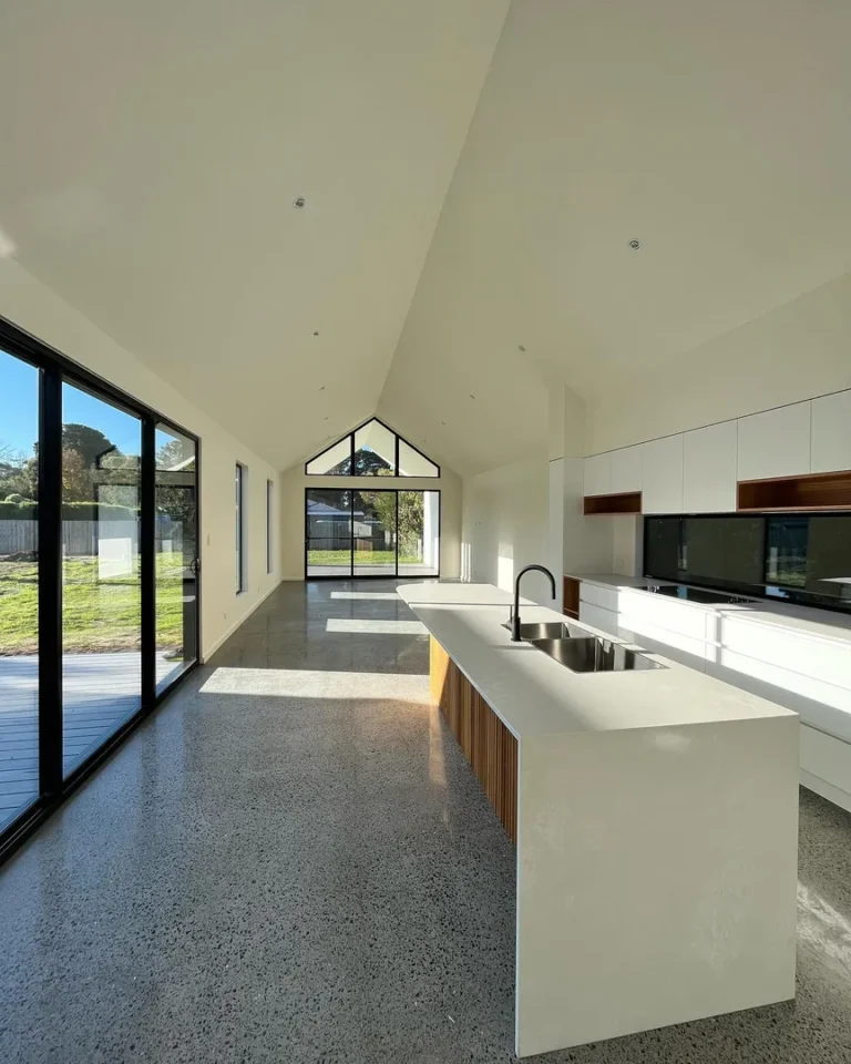 Modern kitchen with large windows and island counter