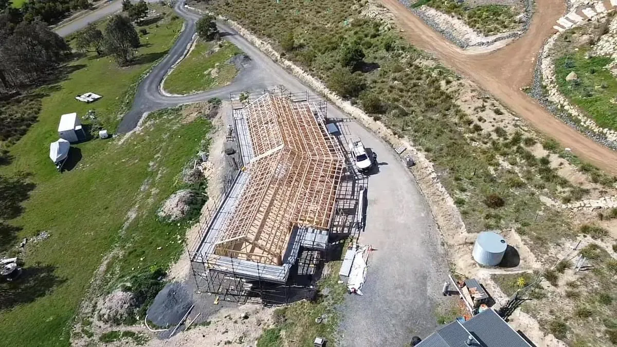 Aerial view of house construction site.