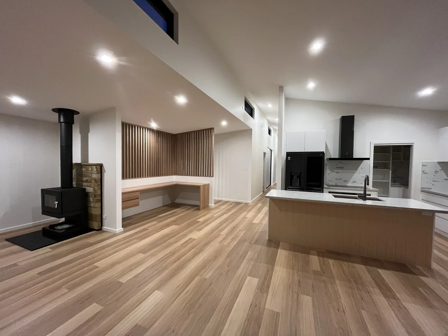 Modern open-plan living room and kitchen design.